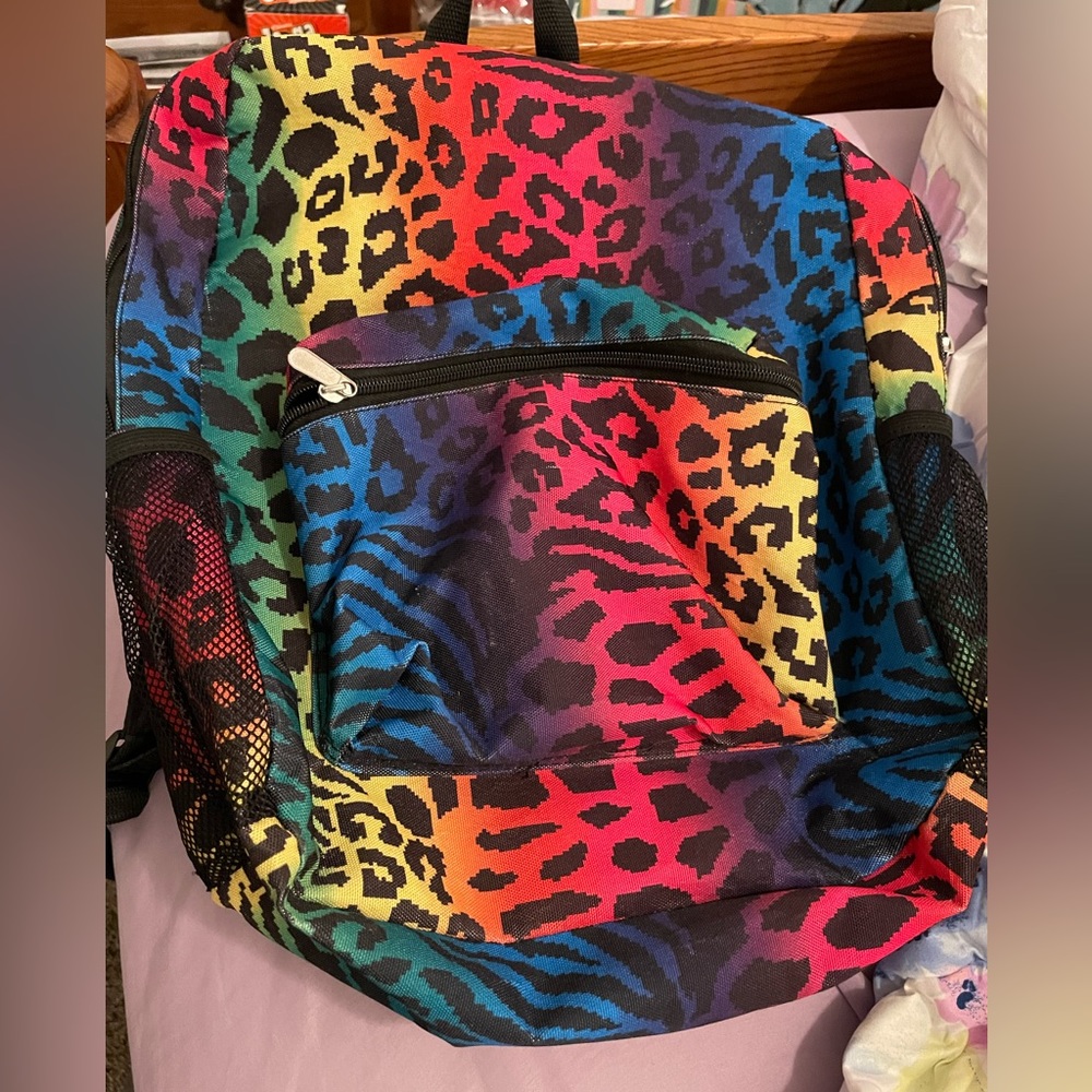 A medium sized colorful backpack.